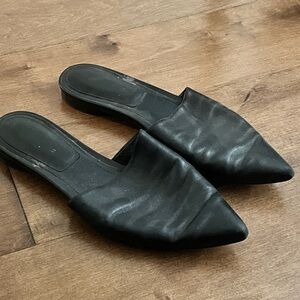 Pointy toed michael Kors collection slip ons.